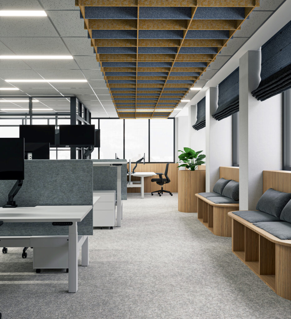 Open-plan Australian office with electric sit-to-stand desks at varied heights